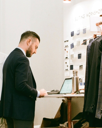 Photo of man working on computer researching tips for wholesale business.