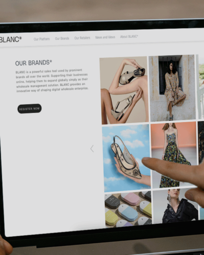 Photo of a person browsing the BLANC platform to find clothing brands for their store